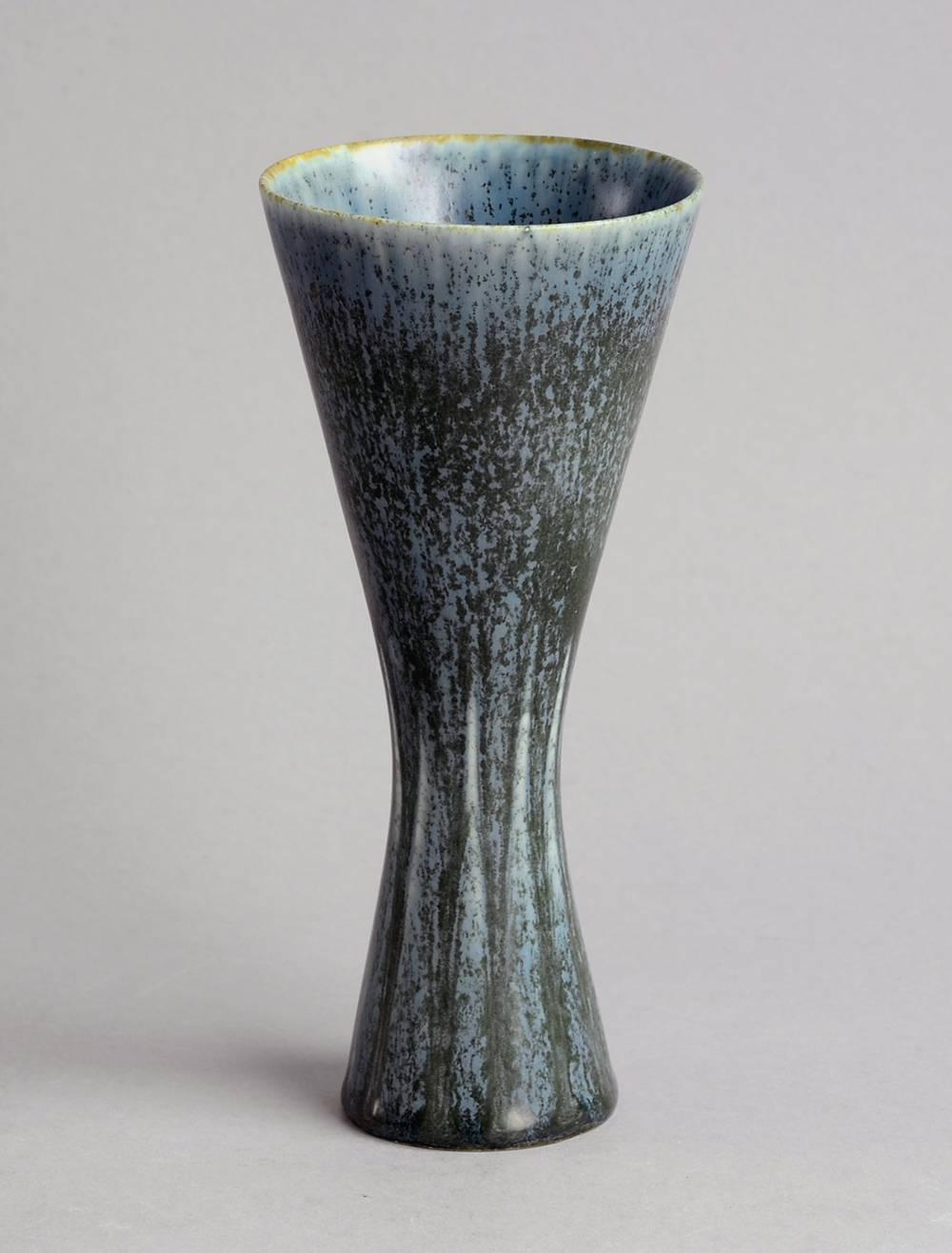 Stoneware vase with matte blue crystalline glaze.
Measures: Height 7 1/4