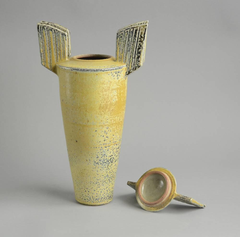 Unique stoneware winged lidded vessel with semi-matte yellow and grey salt glaze.
