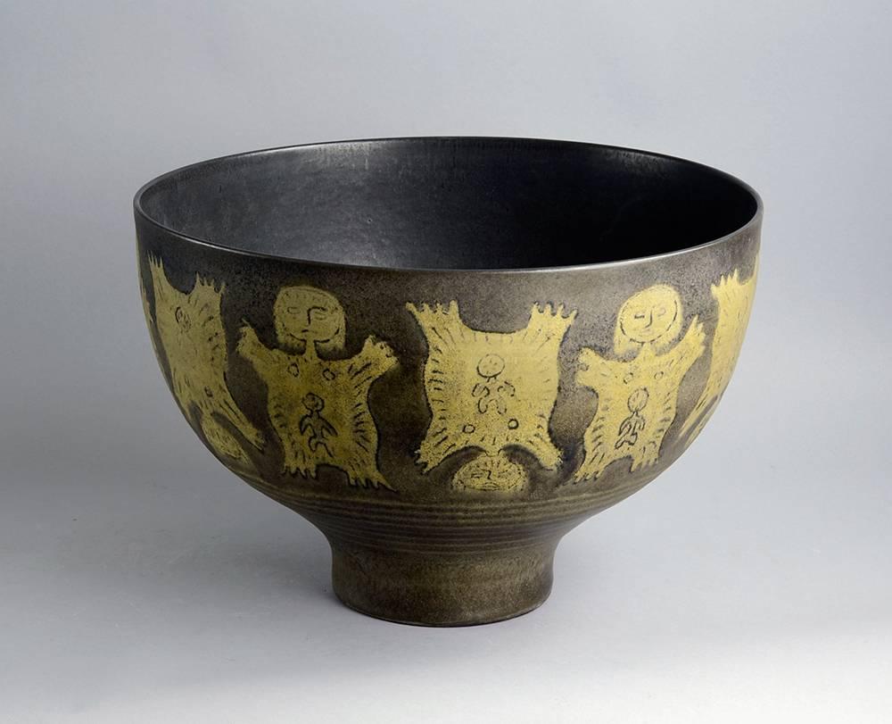 Unique monumental stoneware bowl with stylized women with baby figures with matte beige and brown glaze.