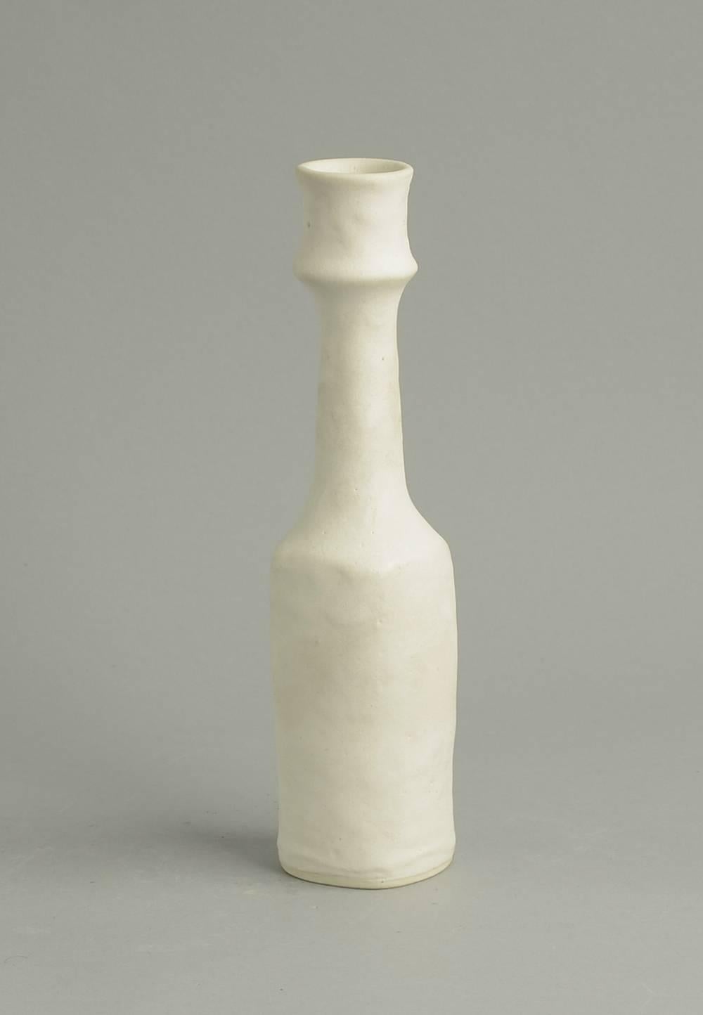 Unique stoneware vase with matte cream glaze, circa 1976.Lightly pitted matte white glaze over white stoneware body. Excellent, undamaged, unrestored conditon. 
Height 10