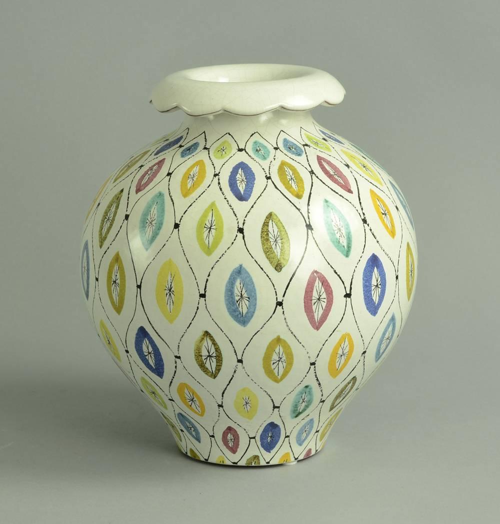 Earthenware vase with multicolored, hand-painted white tin glaze, by Strig Lindberg for Gustavsberg, Sweden,1950s. 
Item is in excellent undamaged condition, but there is all over crackling/crazing to glaze (see photos).