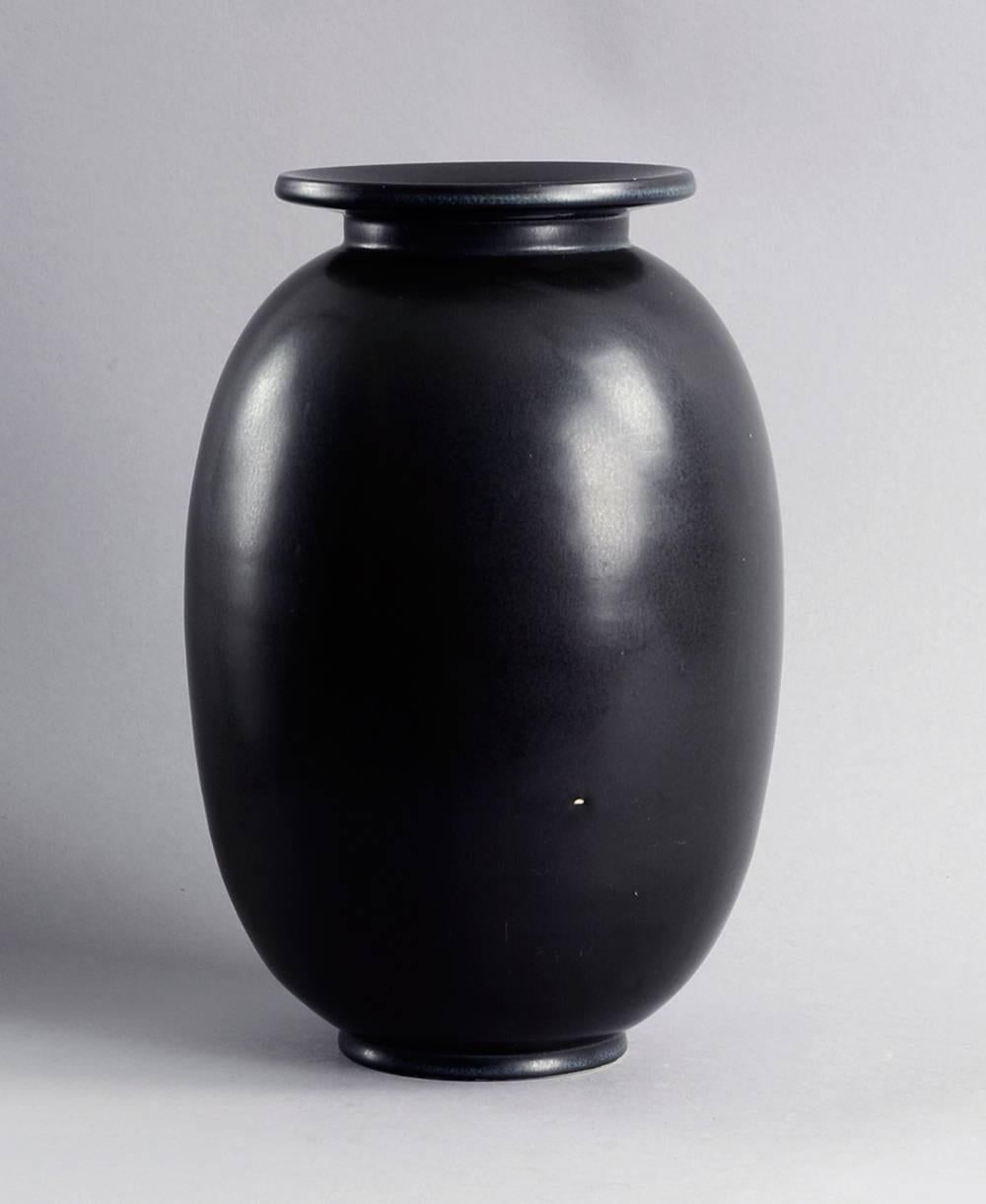 Large stoneware vase with matte black glaze by Gunnar Nylund for Rörstrand, circa 1940s.
Height 11 3/4