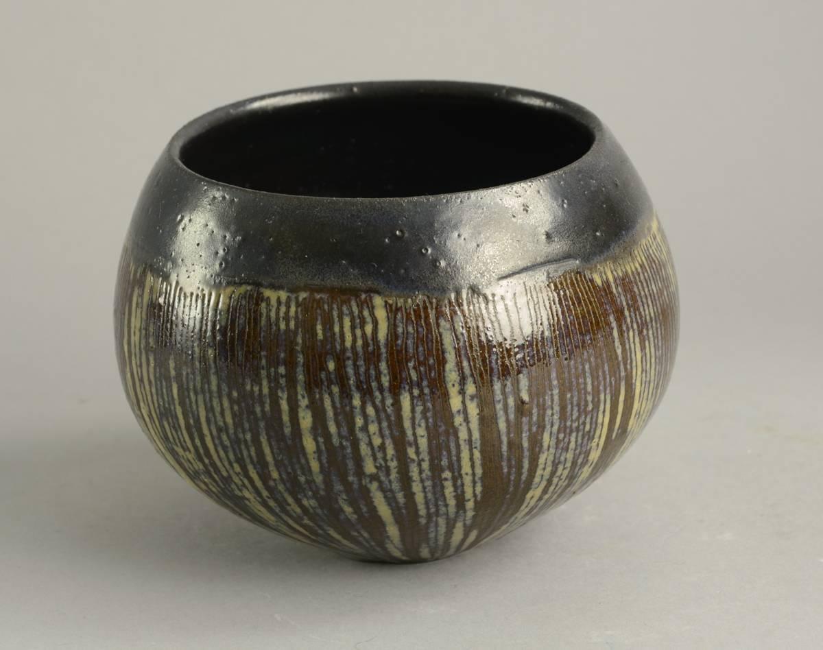 Ingrid and Bruno Asshoff, own studio, Germany

1. Unique stoneware bowl with incised lines to body and glossy black, brown and beige glaze, 1950s-1960s.
Height 4 1/4
