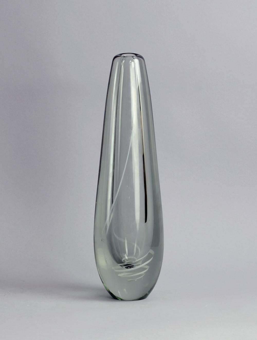 Gunnel Nyman for Nuutajarvi Nottsjo, Finland.

 "Serpentini" (Serpentine) vase in glare glass with white internal decoration, 1940s.
Measures: Height 14 1/4" (37.5cm), width 4 1/2" (11.5cm).
Acid painted "G. Nyman