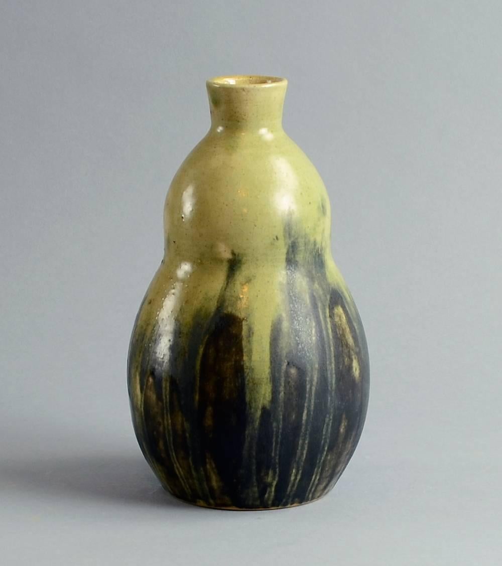 Unique stoneware vase with pale yellow ochre, brown and gray semi-gloss glaze, 1919 by Patrick Nordstrom for Royal Copenhagen, Denmark.
Height 8 1/2