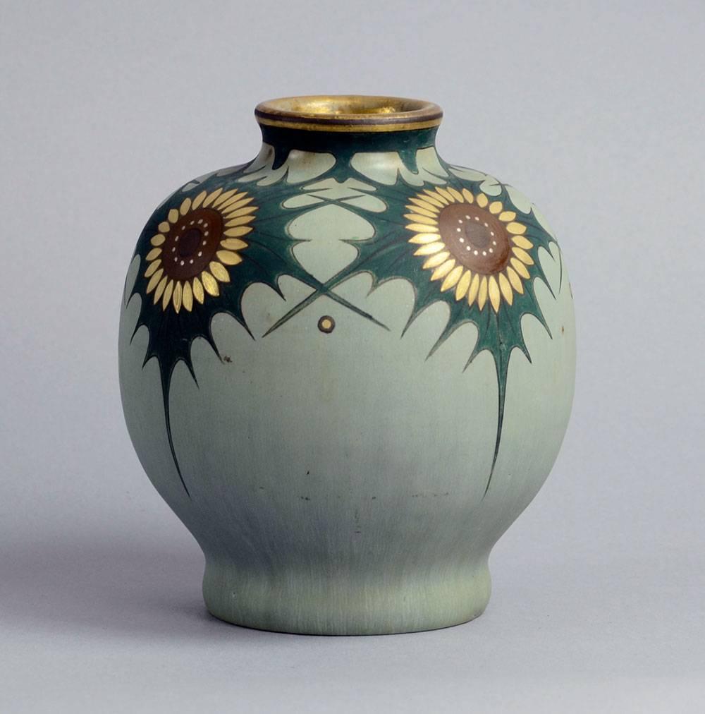 Unique stoneware vase with matte gray glaze and hand painted decoration accented with gold leaf, circa 1910s-1920s.
Designed by Patrick Nordstrom, thrown by Carl Halier, painted by Gustav Kohl, on top of the glaze. There is a GvK monogram to body,