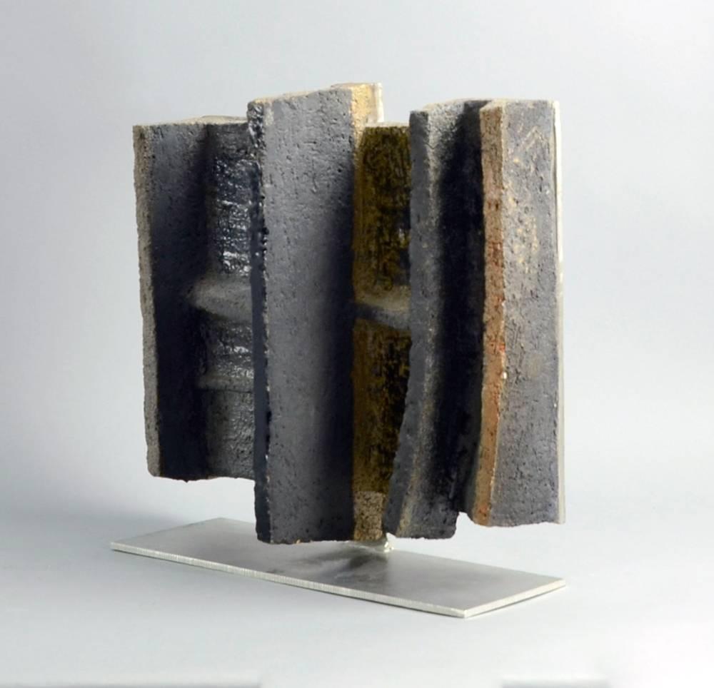 Arne Lundsteen Hansen, own studio, Denmark.
Unique stoneware and metal sculptural form with matte and glossy charcoal and brown glaze, 1969.
Height 13 3/4