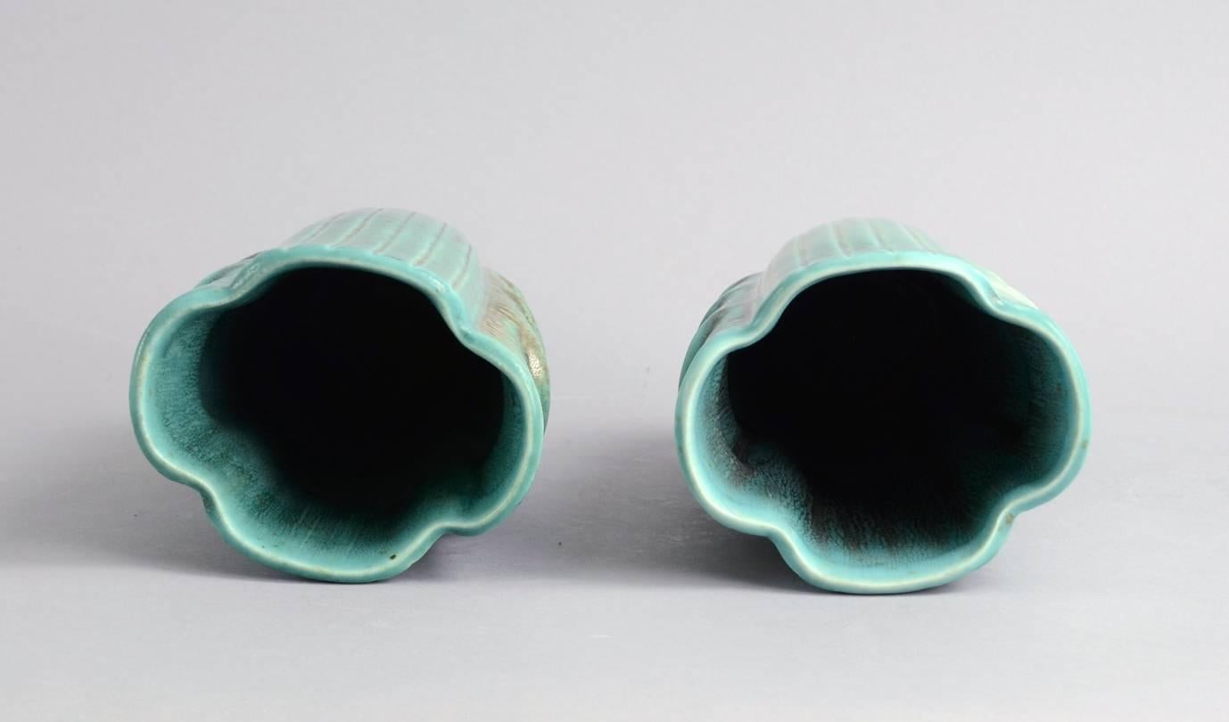 Gunnar Nylund for Rorstrand, Sweden.
Pair of stoneware vases with matte turquoise glaze with brown accents and carved line pattern to exterior, circa 1930s-1940s.
Measures: Height 8 3/4" (22cm), width 5 1/4" (13cm).
Incised