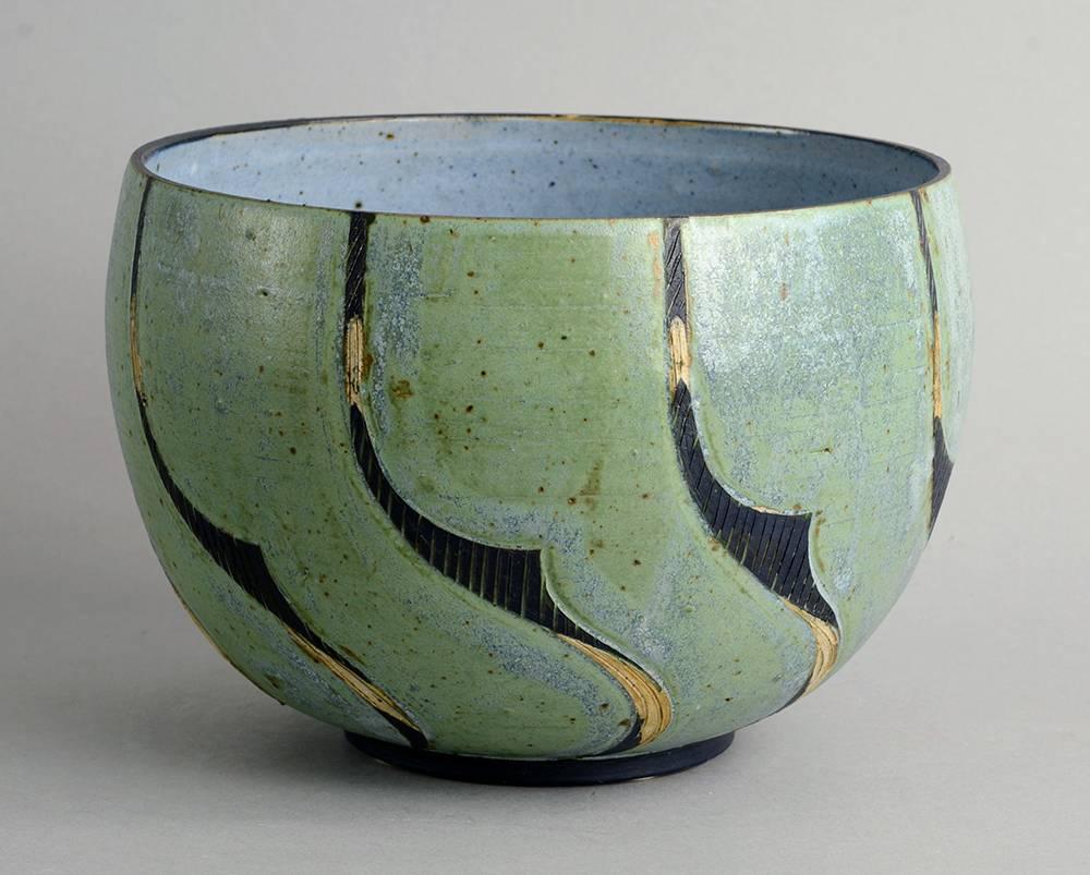 Julie Hom, own studio, Denmark.
Unique stoneware bowl with matte blue, green, beige and charcoal glaze, 1984.
Measures: Height 6 1/2