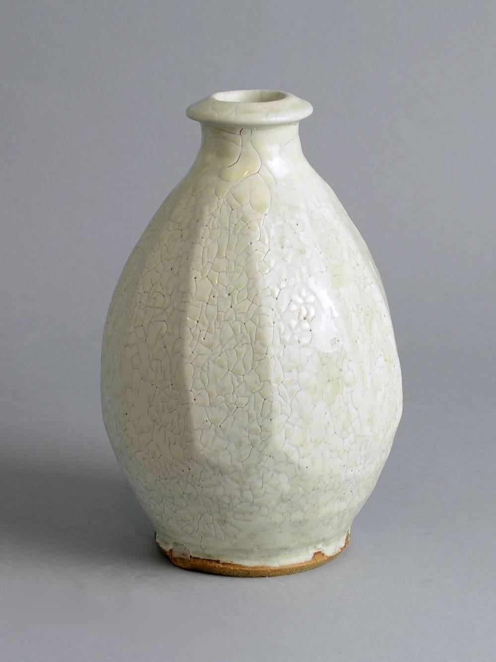 Mike Dodd, own studio, UK.
Unique stoneware vase with glossy off-white glaze.
Measures: Height 9" (22.5cm), width 6" (15cm).
Impressed MD in square.
Excellent condition, no chips, cracks or repairs.