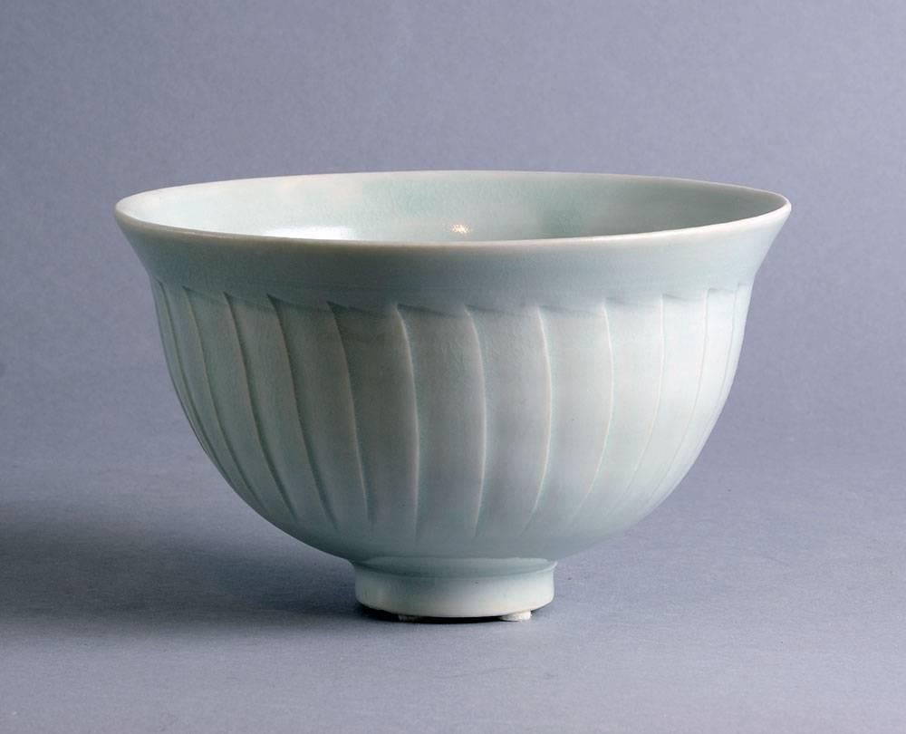 Unique porcelain bowl with carved fluted decoration to body and pale celadon glaze by David Leach, Lowerdown Pottery, UK
Impressed "LD" seal.
Measures: Height 4 3/8" (11cm), width 7 1/4" (18.5 cm).
Excellent condition, no