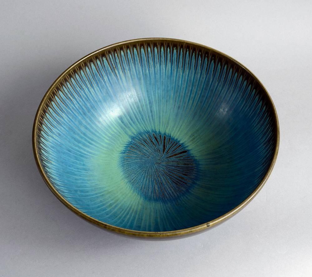 Stig Lindberg for Gustavsberg, Sweden.
Large unique stoneware bowl with matte brown and blue glaze, 1958.
Measures: Height 5