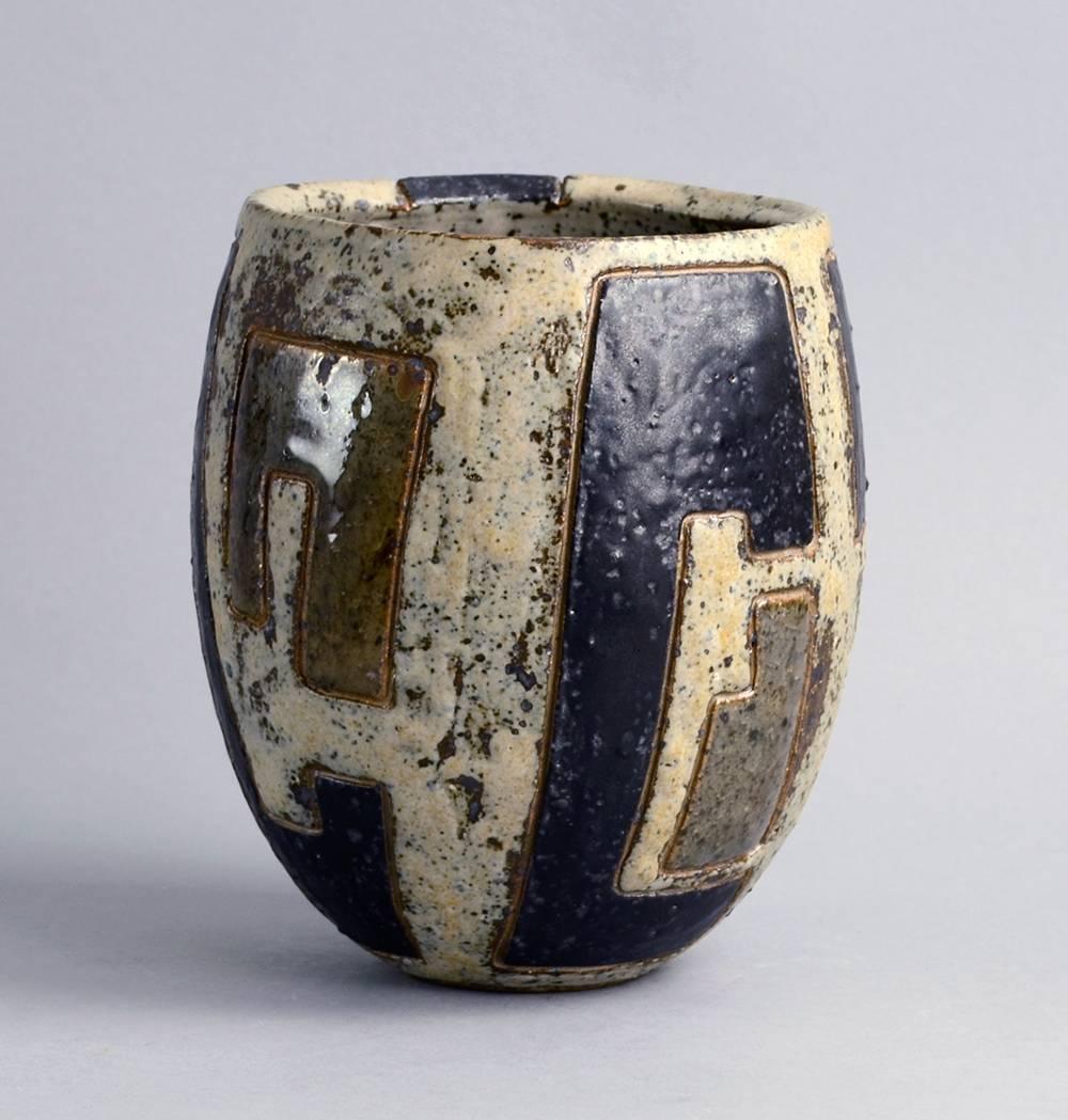 Peter Pritzl, own studio, Germany

Unique stoneware vase with matte gray and black and glossy brown glaze with carved pattern to exterior, 1984.
Measures: Height 8