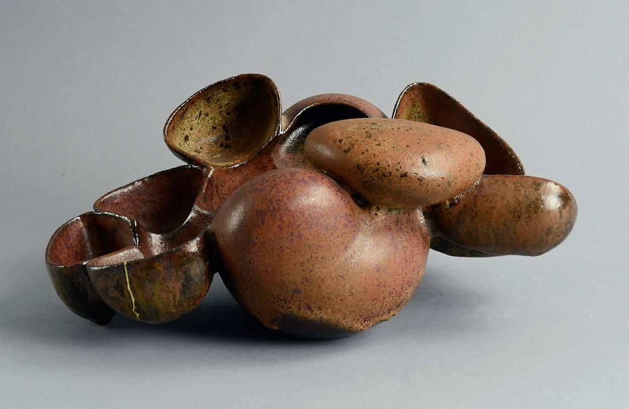 Beate Kuhn, own studio, Germany

Unique stoneware sculptural form with semi matte brown glaze, featuring 