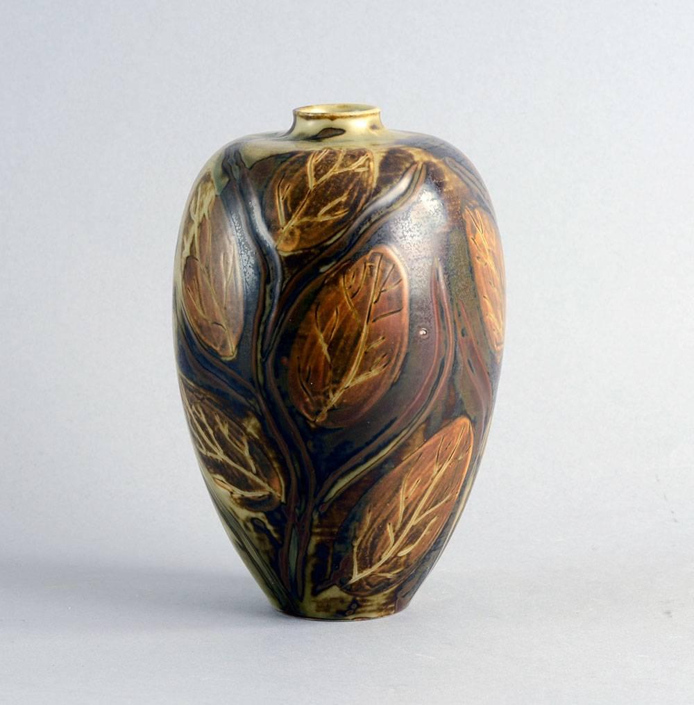Gerd Bogelund for Royal Copenhagen, Denmark 

Unique stoneware vase with hand-painted leaf decoration with matte brown glaze, 1950s.
Measures: Height 7 3/4