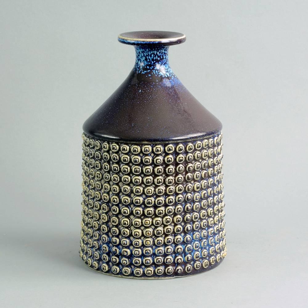 Stig Lindberg for Gustavsberg, Sweden
Unique stoneware vase with applied decoration and glossy purple, blue and pale grey glaze, 1969.
Measures: Height 9 1/2
