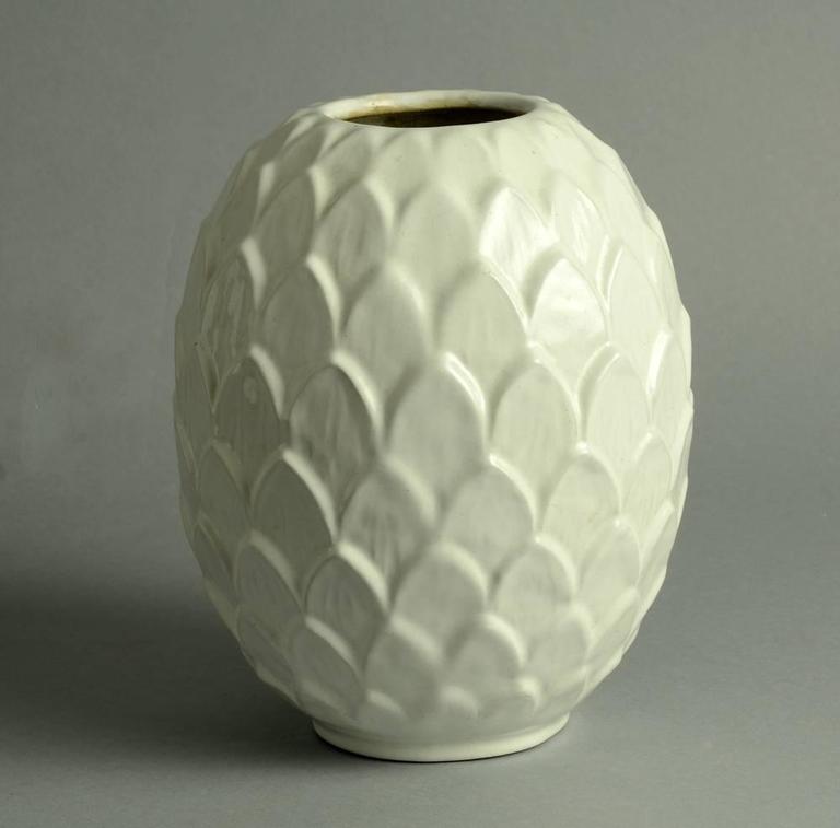 Michael Andersen and Sons, Denmark

Earthenware vase in artichoke form with semi-gloss white glaze, 1930s.
Measures: Height 8