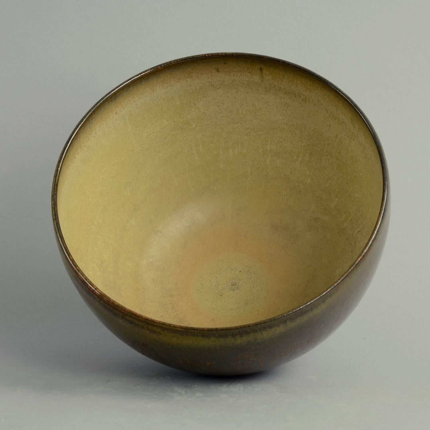Edwin and Mary Scheier, own studio, US 

Unique stoneware bowl with incised illustration of figures and dark brown and purple glossy glaze to exterior, pale brown matte glaze to interior.
Previously from the Piras collection, Italy.
Measure: