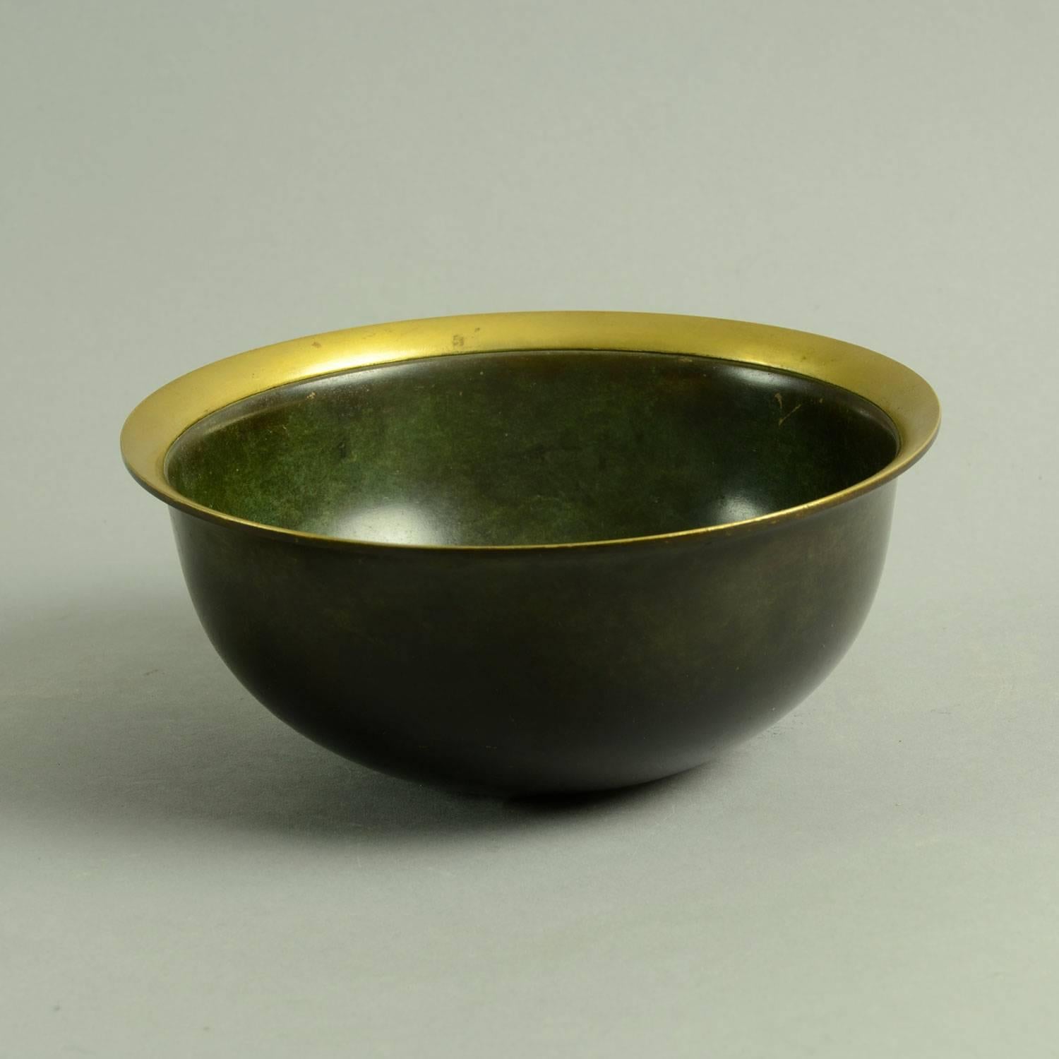 Just Andersen, Denmark

Bronze bowl with turned out polished rim, 1930s.
Measures: Height 2 3/4