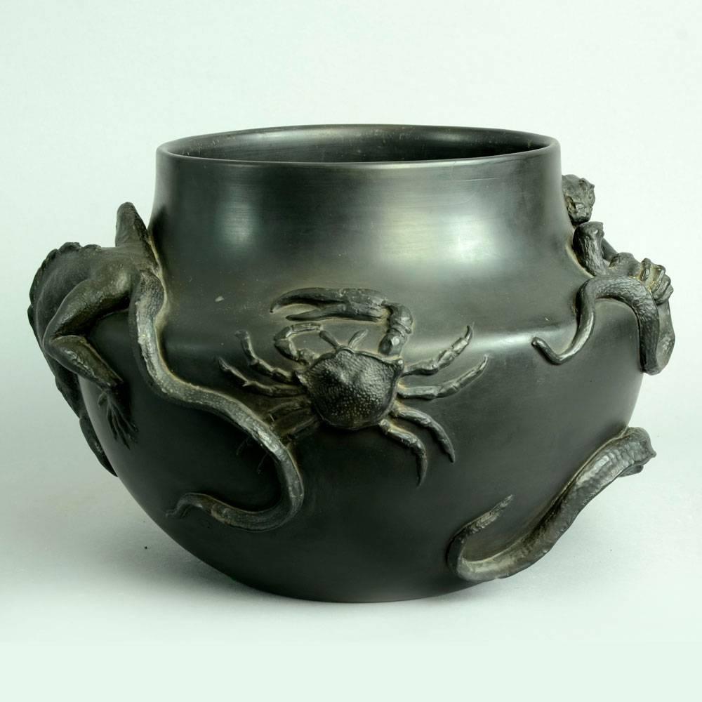 P. Ipsen, Denmark
Large earthenware vase with applied dragons, stag beetle, snake and crab in relief, black matte glaze, circa 1870s.
Measures: Height 9