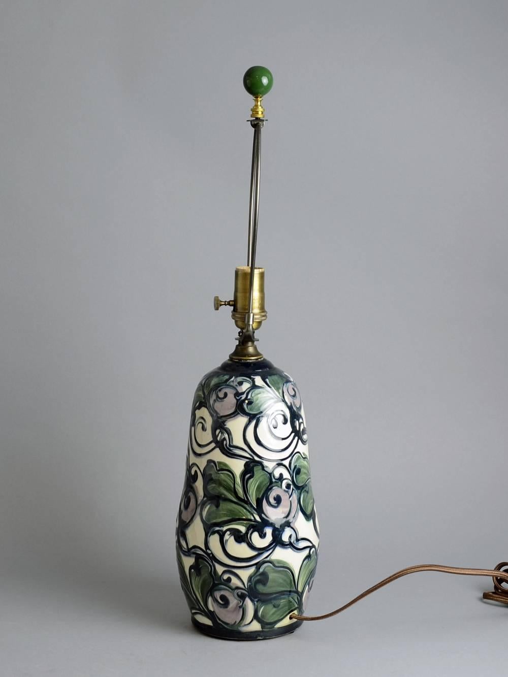 Sofie Lundstein for Herman A. Kahler Keramik

Unique earthenware lamp with glossy glaze in floral pattern, circa 1910s-1920s.
Measure: Height to socket 16