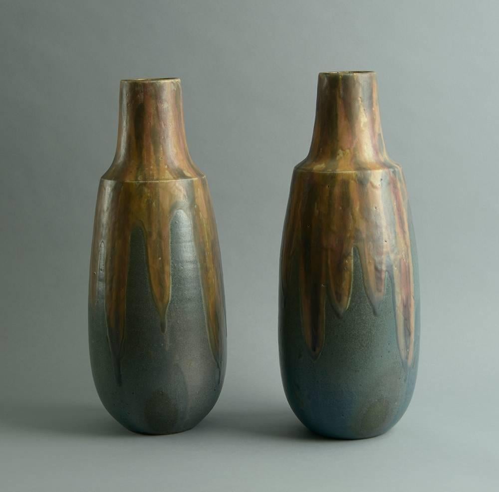 Pair of stoneware vases with matte glaze in shades of brown and grey.