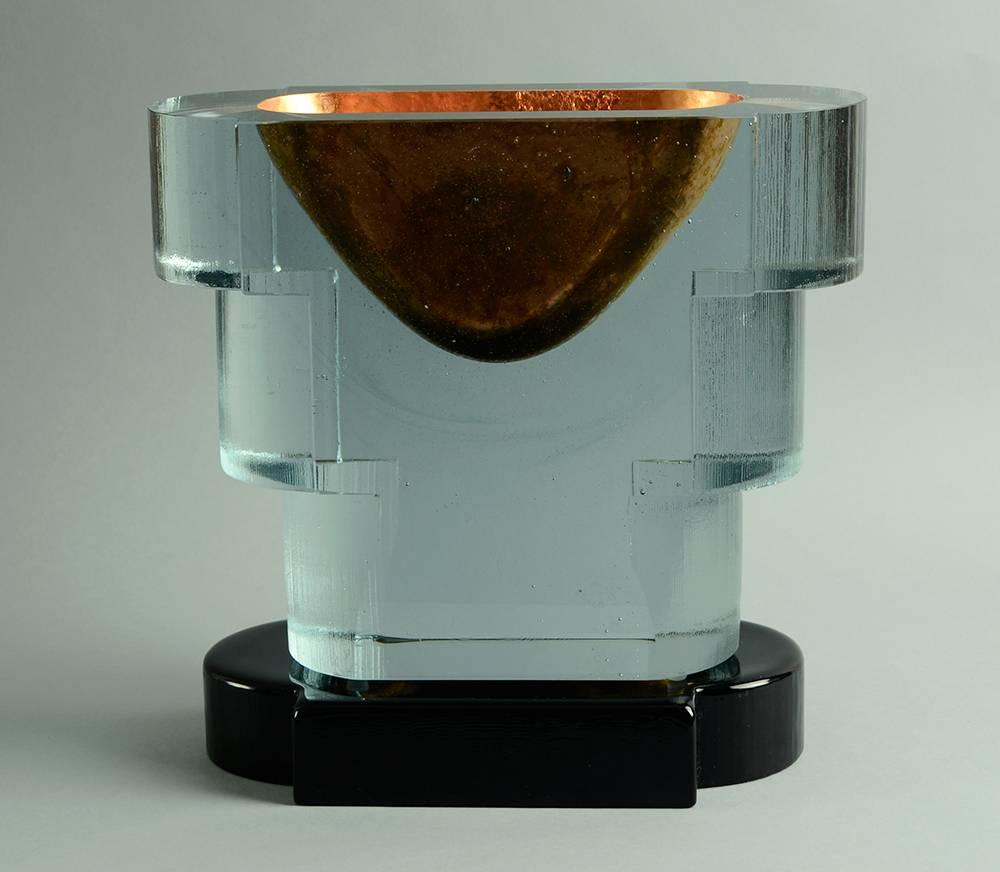 "Copper Guggenheim" large cast glass sculptural vessel with copper inlay with dark blue glass base, circa 1990.