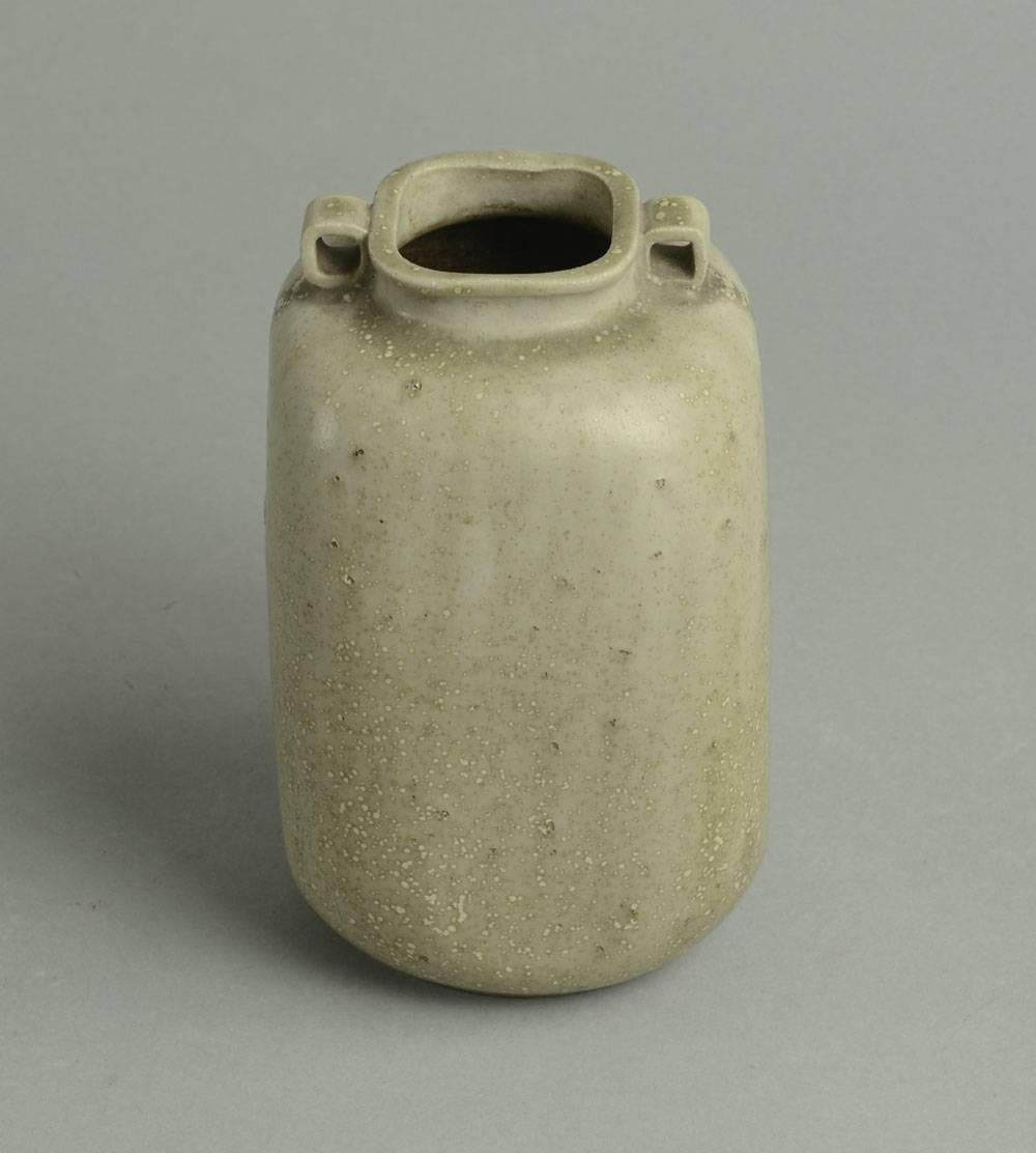 1. Stoneware handled vase with pale gray/cream glaze, 1930s-1940s
Height 6