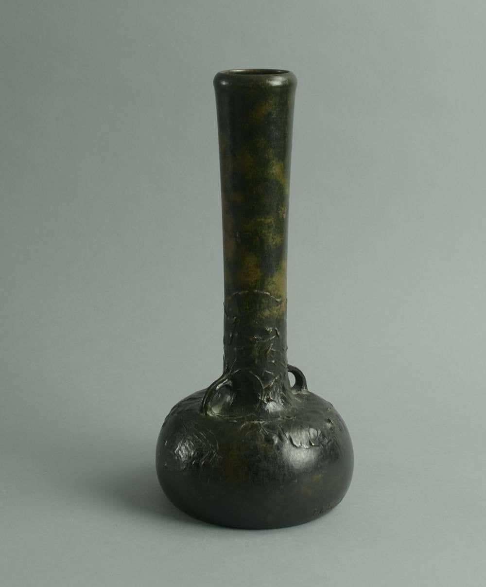 Bronze handled vase with applied floral decoration, c. 1900.
