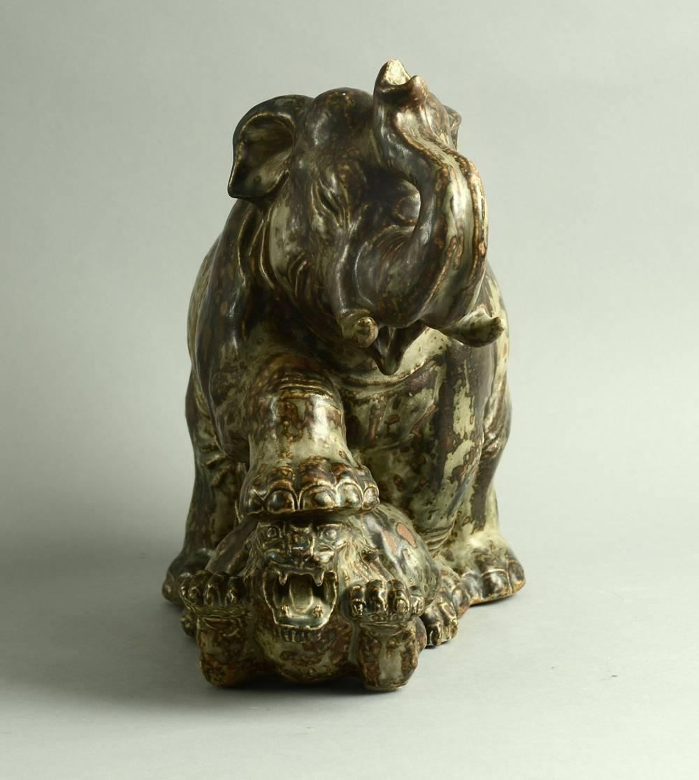 Stoneware statue of elephant and tiger with sung glaze, circa 1930s-1940s.