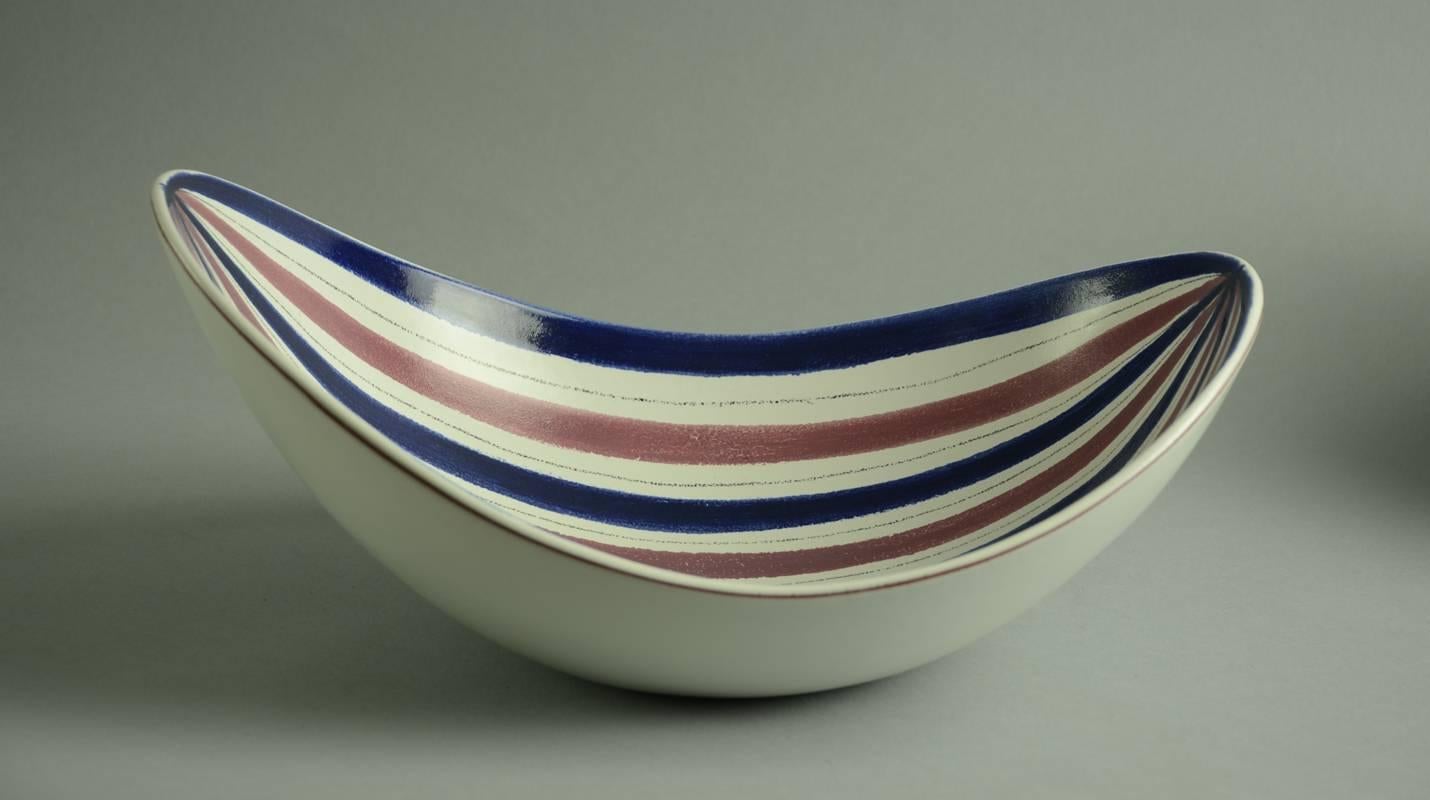 1 "Faience" earthenware bowl with white tin glaze, hand-painted pattern in purple and blue, 1950s-1960s. Tight hairline crack to body.
Measures: Height 6" (15cm), width 13 3/4" (35cm). No. A1461.
 
2. "Faience"