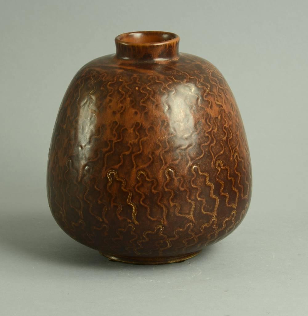 1. Stoneware vase with matte reddish brown glaze and impressed oak leaf pattern to body, 1960s.
Measures: Height 8