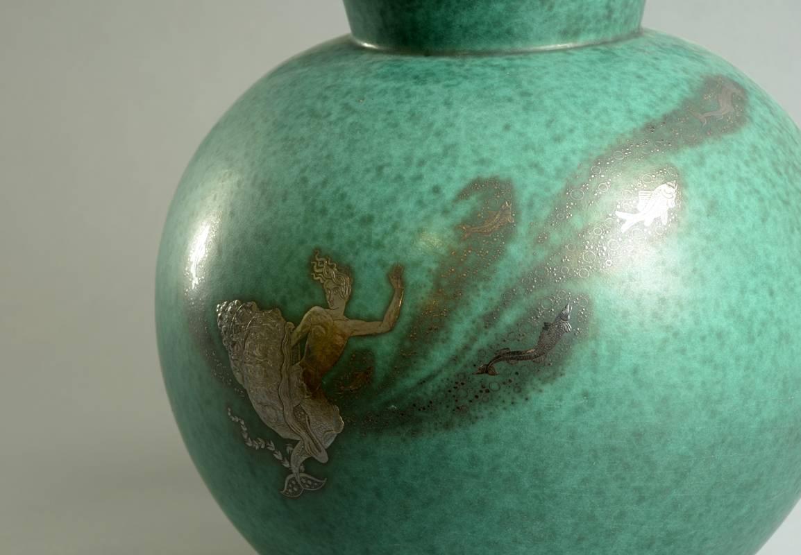 Very large Argenta vase with underwater scenes of a mermaid and fish.