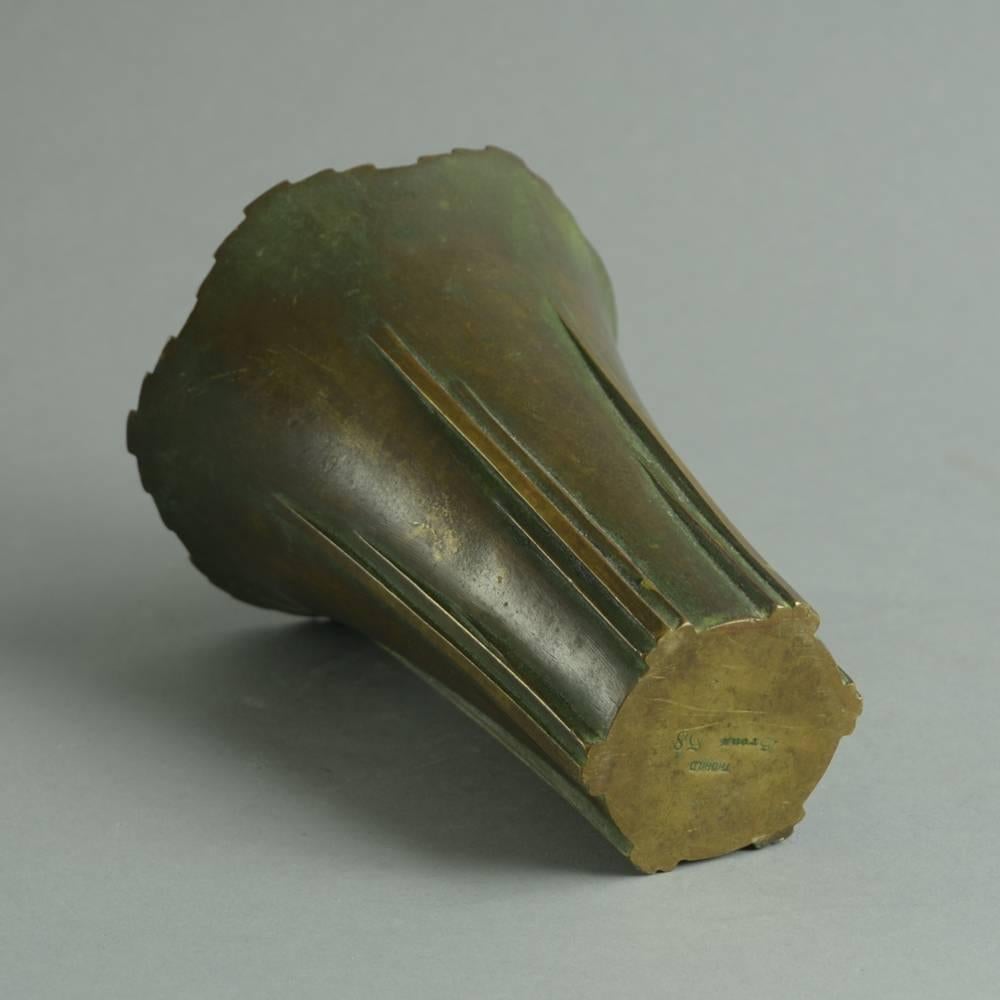 Bronze vase with step-cut edge.