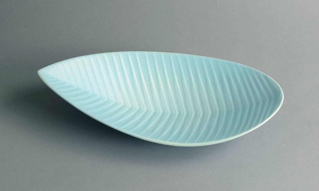 1. "Reptil" leaf shaped dish with impressed pattern to body with matte pale blue glaze, 1950s-1960s.
Measure: Height 3" (7.5 cm) width 12 1/2" (31.5 cm).No. A1892.

2. "Reptil" vase with matte yellow glaze,