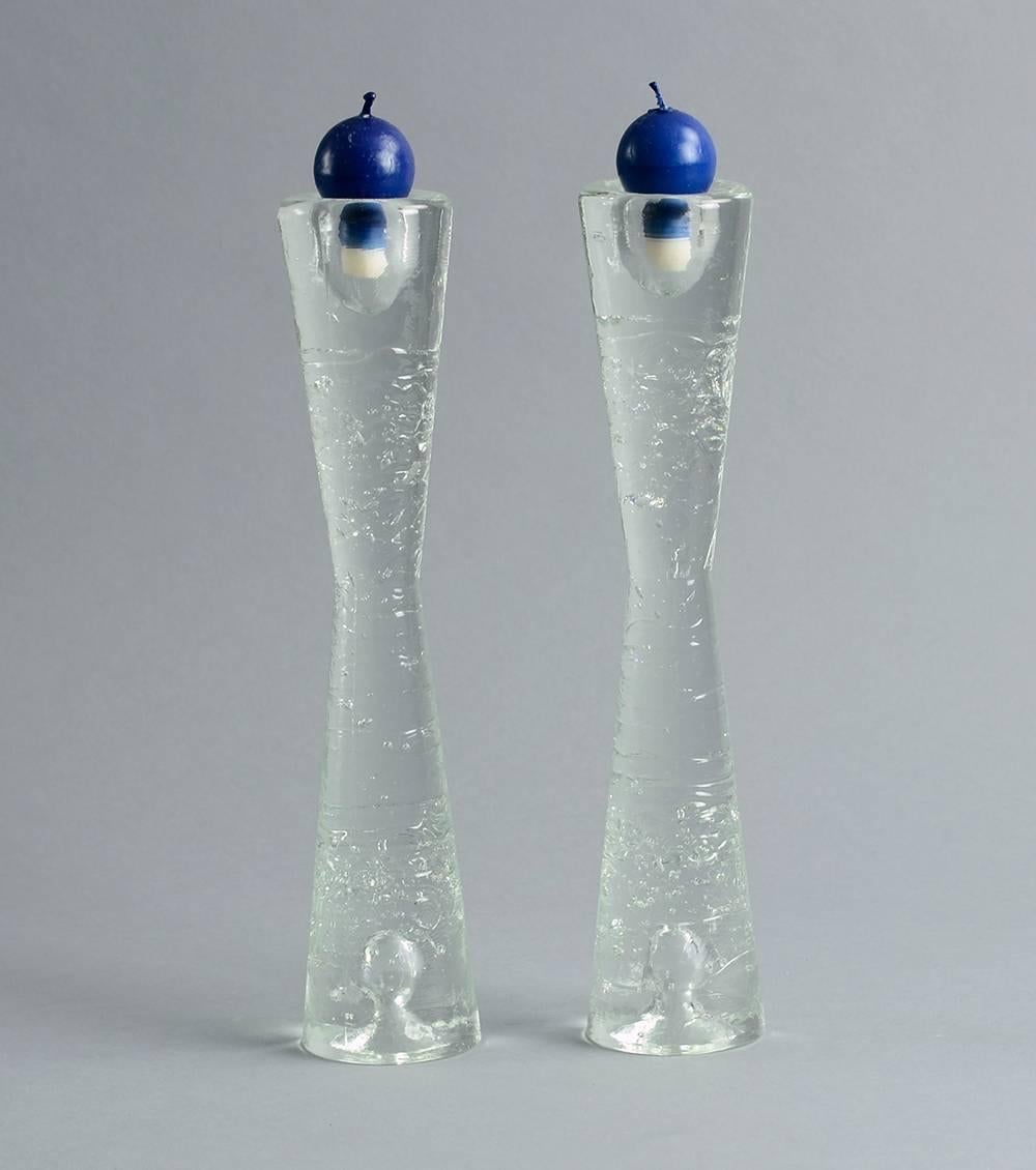 Pair of glass candlesticks internally decorated with bubbles and textured exterior in clear glass.