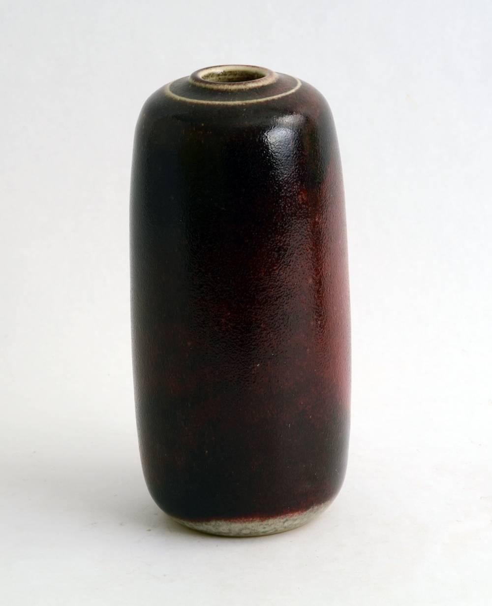 1. Unique stoneware vase with oxblood glaze.
Height 7" (18cm) Width 3 1/4" (8.5cm) No. N8356.

2. Stoneware vase with glossy oxblood glaze.
Height 8 3/4" (22.5cm) Width 5" (13cm) No. A2161.

3. Stoneware vase with glossy