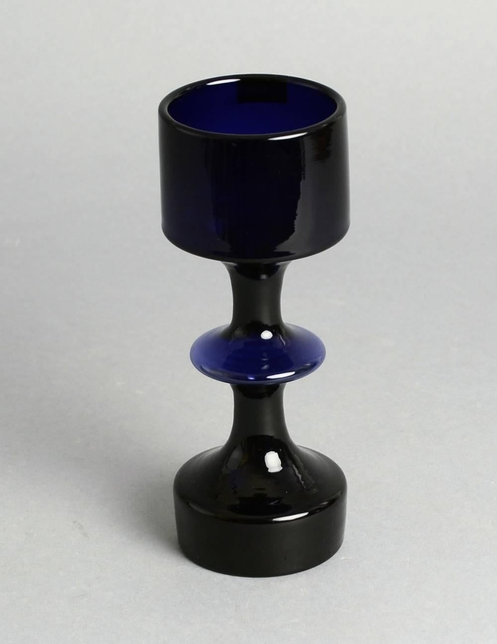 Kaj Franck for Nuutäjarvi-Nottsjö

1. Goblet vase in blue glass, 1964.
Height 7" (18cm) Width 2 1/2" (6.5cm) No. N9776
2. Segmented vase in black glass.
Height 9 1/4" (23.5 cm) Width 3 1/2" (9cm) No. N9511
3. Decanter in