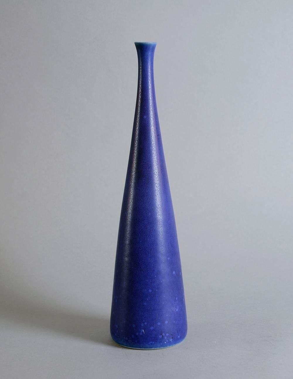 Stoneware vase with matte cobalt blue glaze.
   