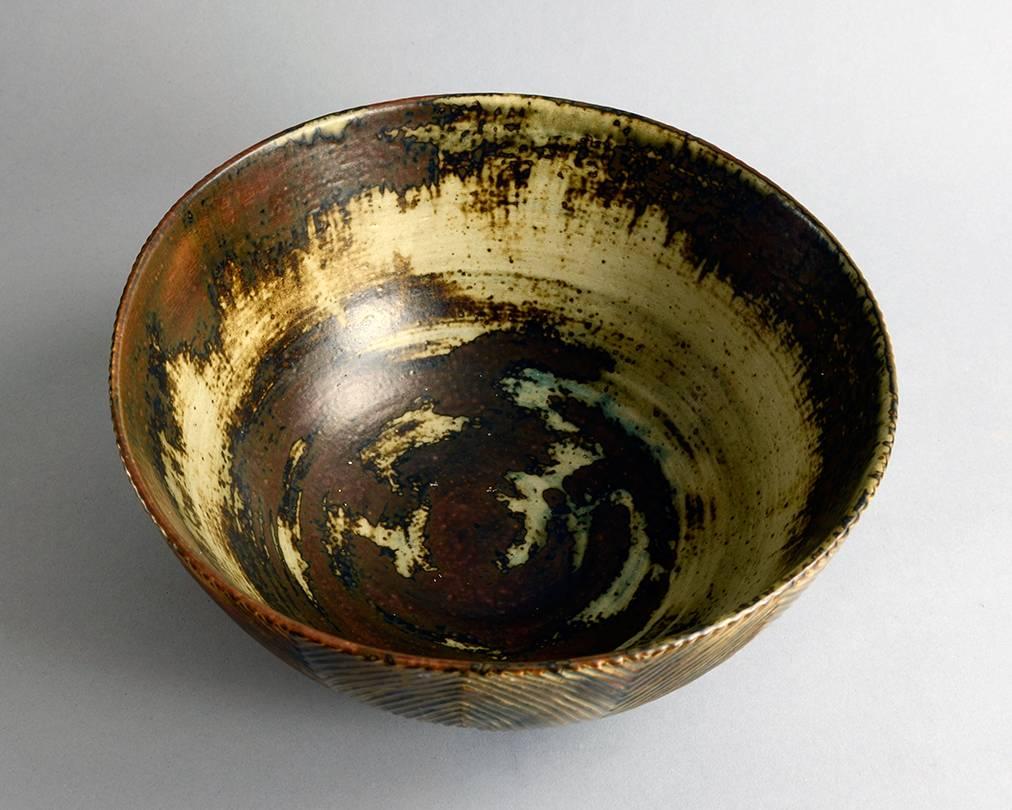  Large stoneware bowl with carved line pattern to exterior and Sung glaze, 1967.