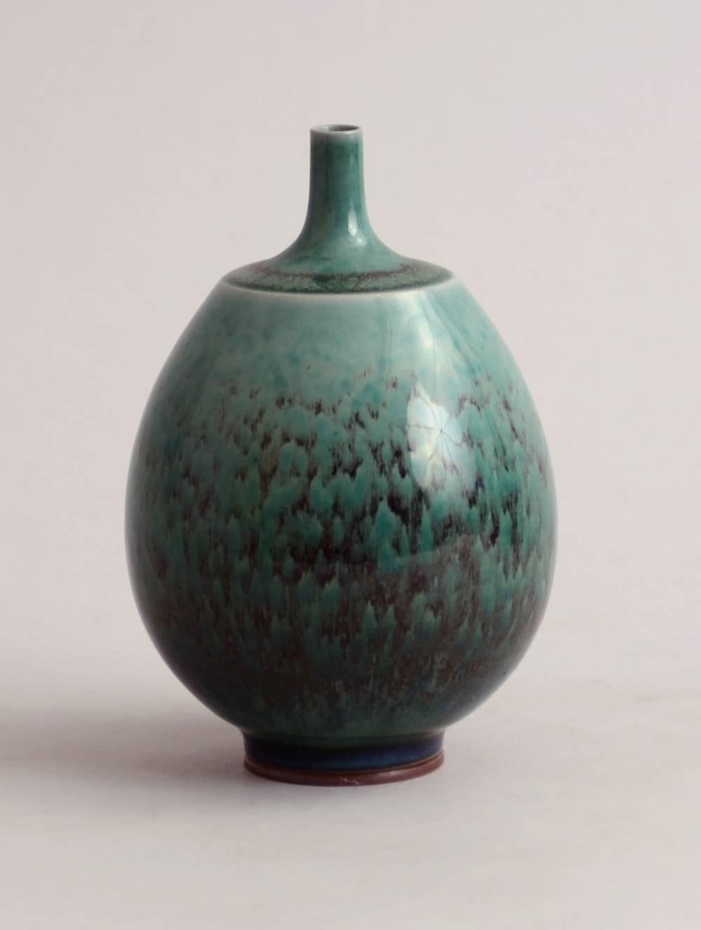 1. Unique stoneware cabinet vase with glossy turquoise glaze, 1965. 
 height 5 1/4" (13.5) width 3 3/4" (9.5cm) no. N8213
 2. Unique stoneware vase with high-gloss copper red glaze with turquoise highlights, 1970. 
 height 7 1/4"