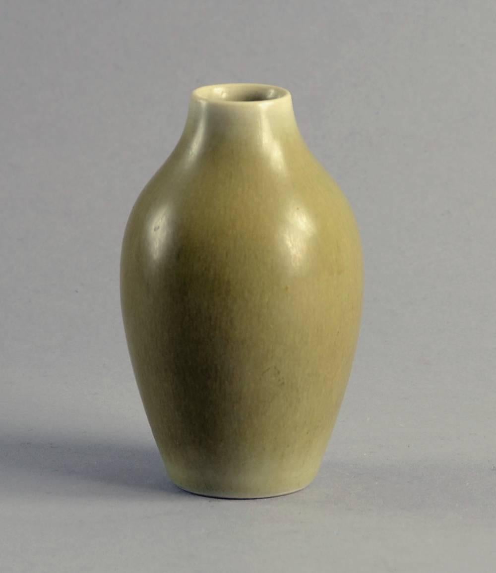Per and Annelise Linnemann Schmidt for Palshus, Denmark.

1. Stoneware vase with matte olive haresfur glaze, 1950s-1960s.
Height 4 1/4" (11 cm) width 2 3/4" (7 cm).
Incised "Palshus Denmark PLS-1116".
No. B3615.

2.