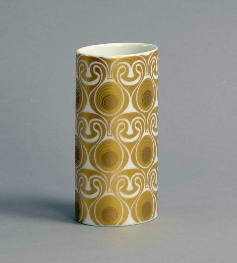 Bjorn Wiinblad for Rosenthal, Germany.

Porcelain vase with glossy white glaze with gold decoration.
Measures: Height 4 3/4" (12cm), width 2 1/2" (6.5cm).
Printed "Rosenthal studio-linie Germany Bjorn Wiinblad" No.