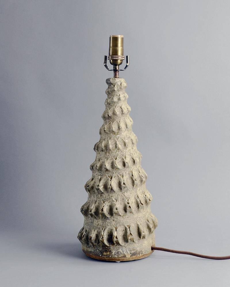 Alan Wallwork, own studio, UK

Unique stoneware lamp with spiraled ridged protrusions and matte cream and gray glaze.
Height to top of socket 19 1/2
