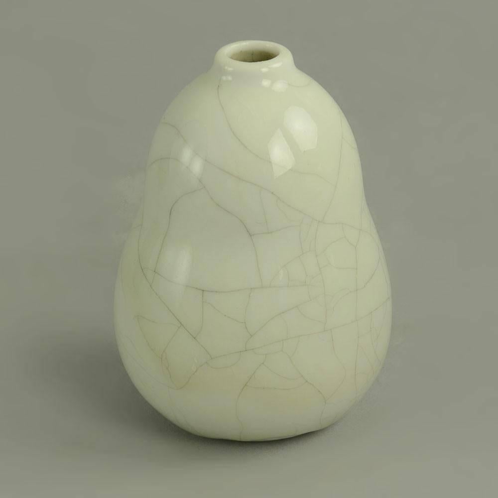 Friedl Holzer Kjellberg for Arabia, Finland

Porcelain vase with glossy white crackle glaze, 1960s
Incised "Arabia F H Kj"
Measures: Height 3 3/4" (9.5 cm), width 2 1/2" (6.5 cm) 
Excellent condition, no chips, cracks or