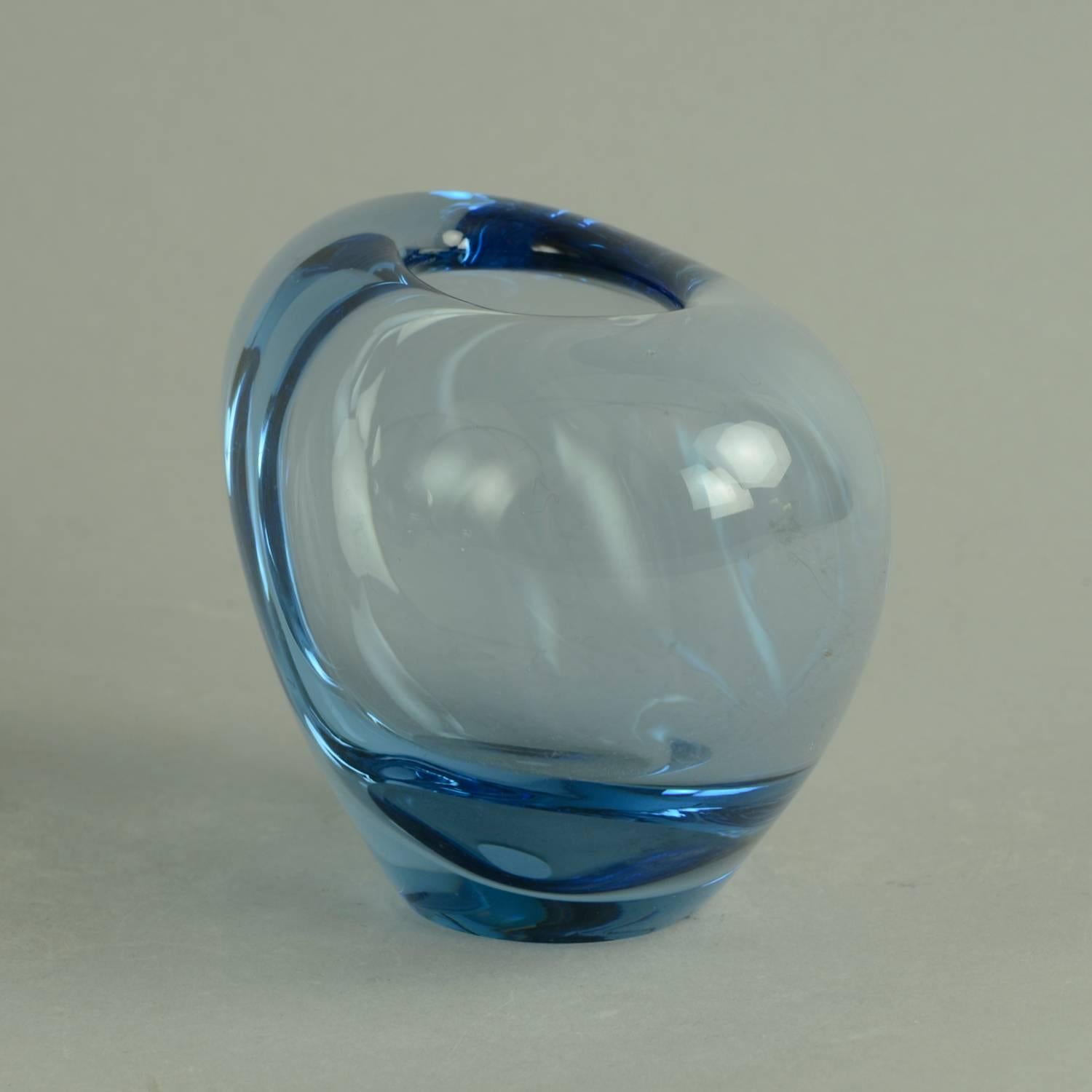 1. Heart shaped glass vase in pale blue glass, 1950s-1960s.
Measures: Height 4" (10cm), width 6" (15.5cm)
Engraved "Holmegaard PL 220127" No. N8701

2. Heart shaped glass vase in pale blue glass, 1958.
Measures: Height
