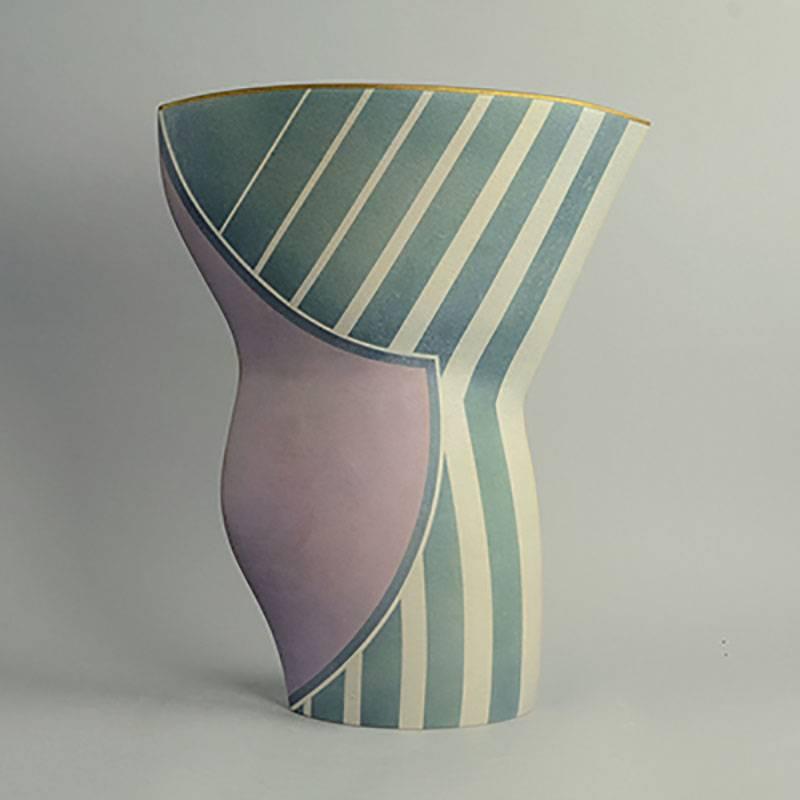 Jon Middlemiss, own studio, UK

Very large, unique hand built sculptural vessel, with rough surfaces matte glaze in pale purple, blue and gray, with gold rim, 1996.
Measure: Height 18 1/2