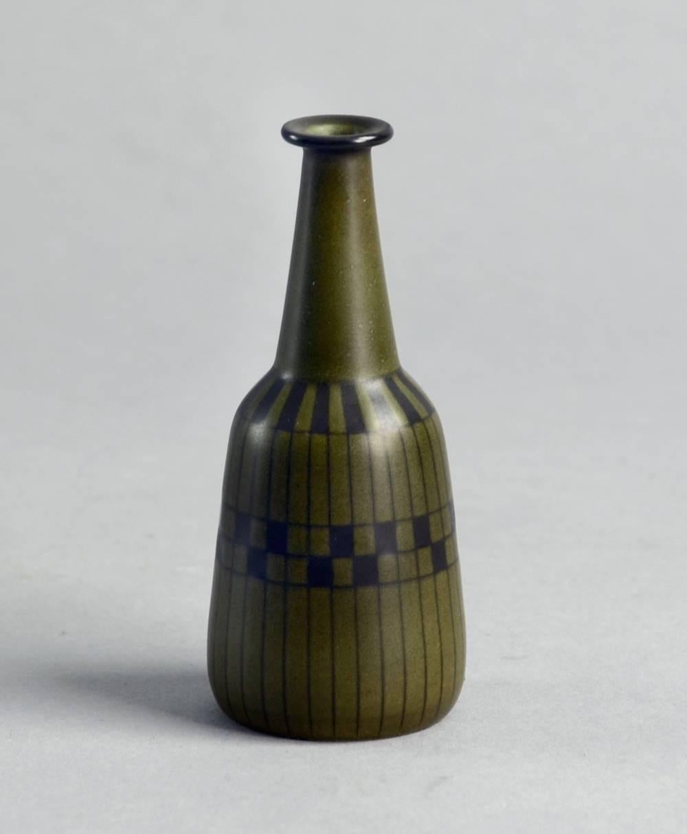 1. Gunnar Nylund for Nymolle, Denmark
Miniature stoneware vase with matte olive green glaze with black line decoration.
Measures: Height 3 3/4