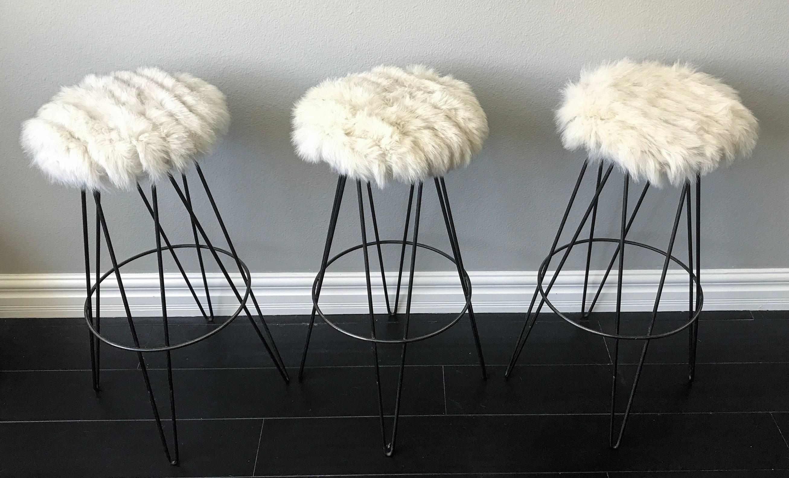 A stunning set of three original thinline of California hairpin iron bar stools upholstered in vintage cream colored real fox fur. 

This head-turning, statement set is ultra luxe!