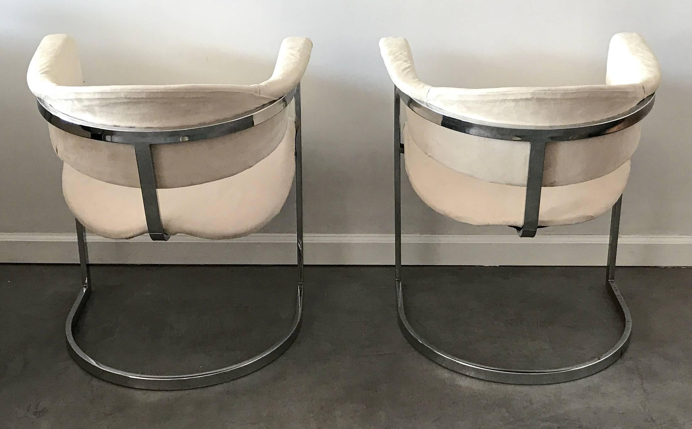 A stunning set of Mario Sabot chrome arm chairs upholstered in a cream colored microsuede material. These accent chairs would compliment any modern or contemporary environment quite nicely.